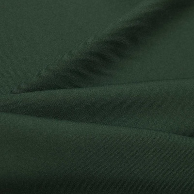Ткань костюмная 21010 2076, 225 гр/м2, шир.150см, цвет т.зеленый - купить в Санкт-Петербурге. Цена 390.73 руб.